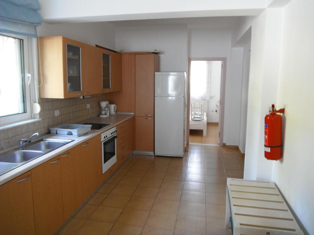 Kuchyň nebo kuchyňský kout v ubytování Mandorla Apartments