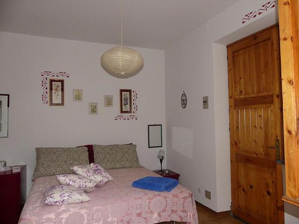 Postel nebo postele na pokoji v ubytování Casa La Forsizia