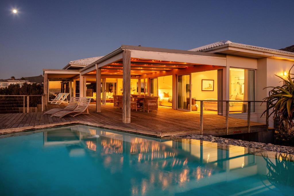 a house with a swimming pool and a deck at Pringle Bay Villa by Raw Africa Collection in Pringle Bay