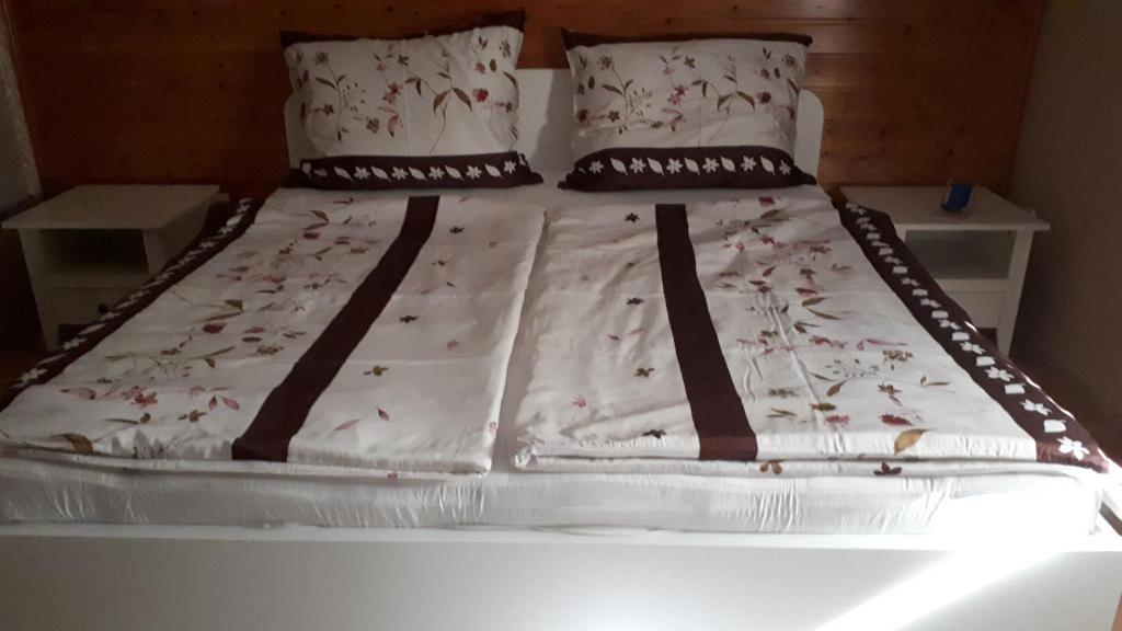 Postel nebo postele na pokoji v ubytování Fehér Rózsa Apartman