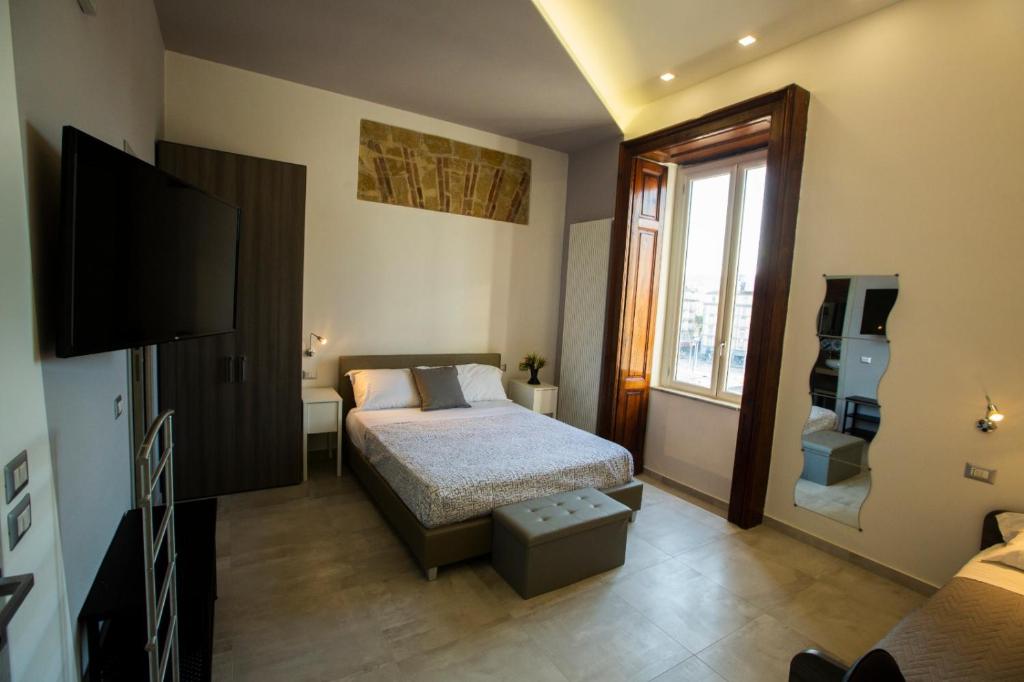 A bed or beds in a room at Bayard101