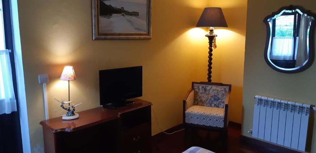 TV a/nebo společenská místnost v ubytování Hotel Rural El Pagadín