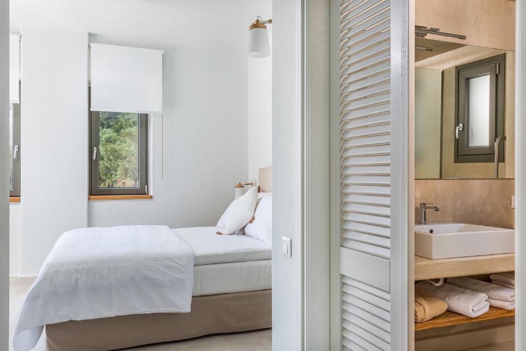 Postel nebo postele na pokoji v ubytování Elios Private Living