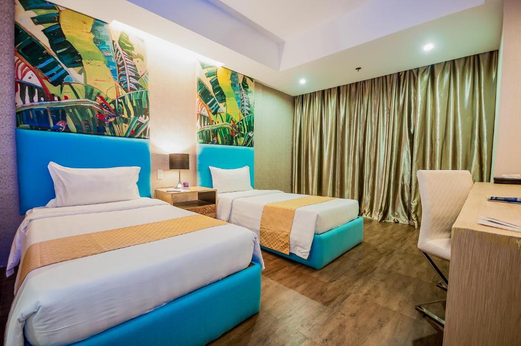 Postel nebo postele na pokoji v ubytování Aziza Paradise Hotel