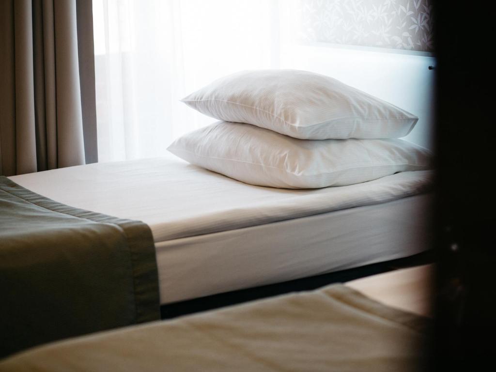 Posteľ alebo postele v izbe v ubytovaní Q Hotel Grand Cru Gdańsk