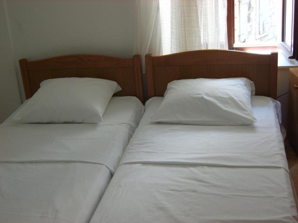 Postel nebo postele na pokoji v ubytování Rooms Roso