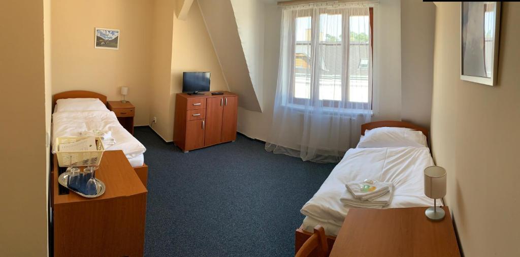 Postel nebo postele na pokoji v ubytování Lázeňský dům Florentini