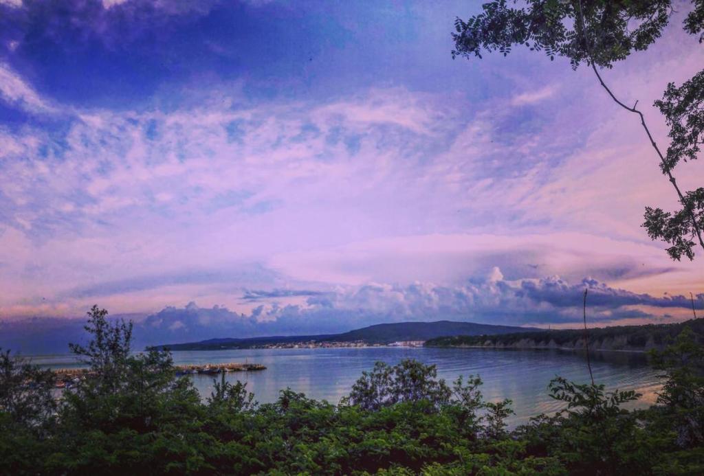 a view of a lake with a cloudy sky at Complex Chayka Guest House in Byala