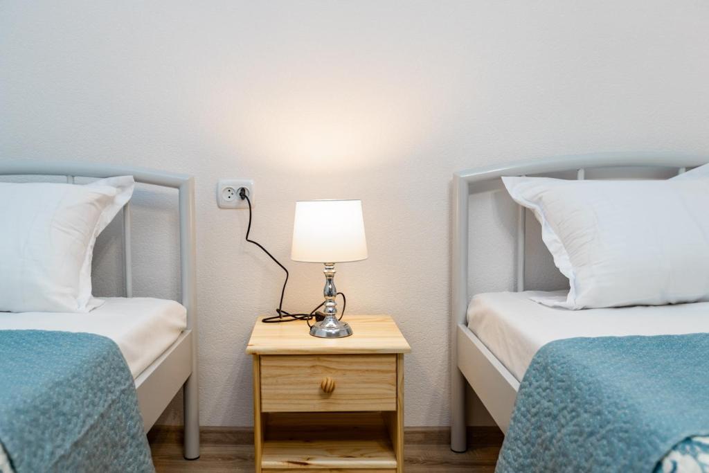 Postel nebo postele na pokoji v ubytování Guest House Nana