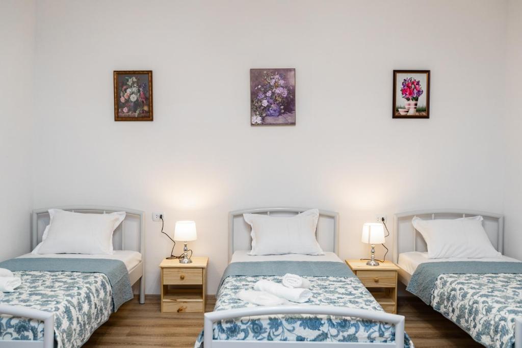 Postel nebo postele na pokoji v ubytování Guest House Nana