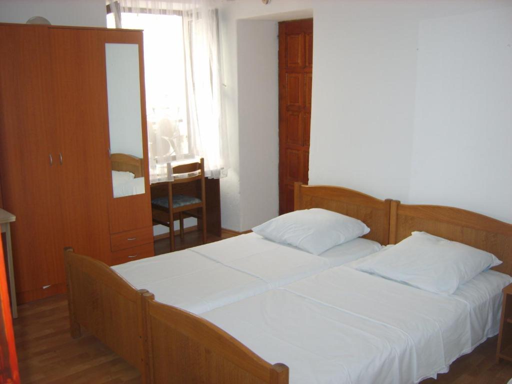 Postel nebo postele na pokoji v ubytování Rooms Roso