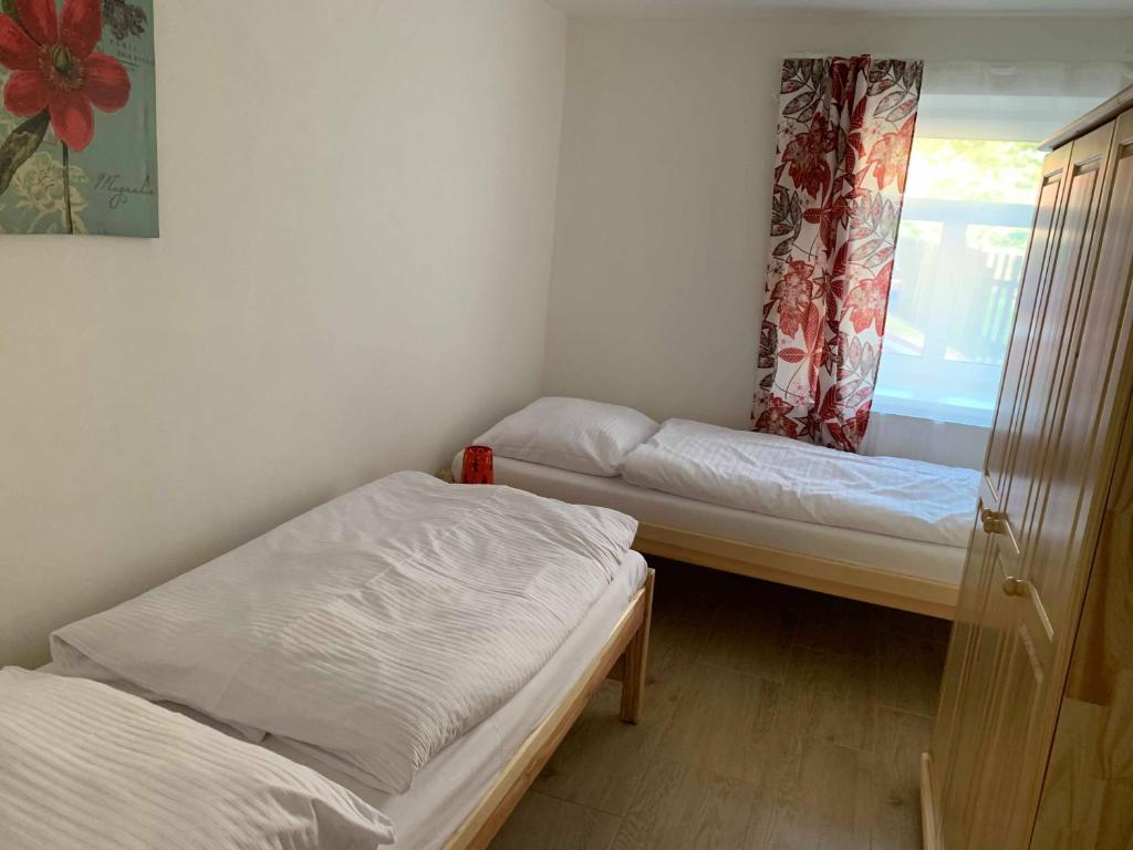 Postel nebo postele na pokoji v ubytování Apartmány Michaela