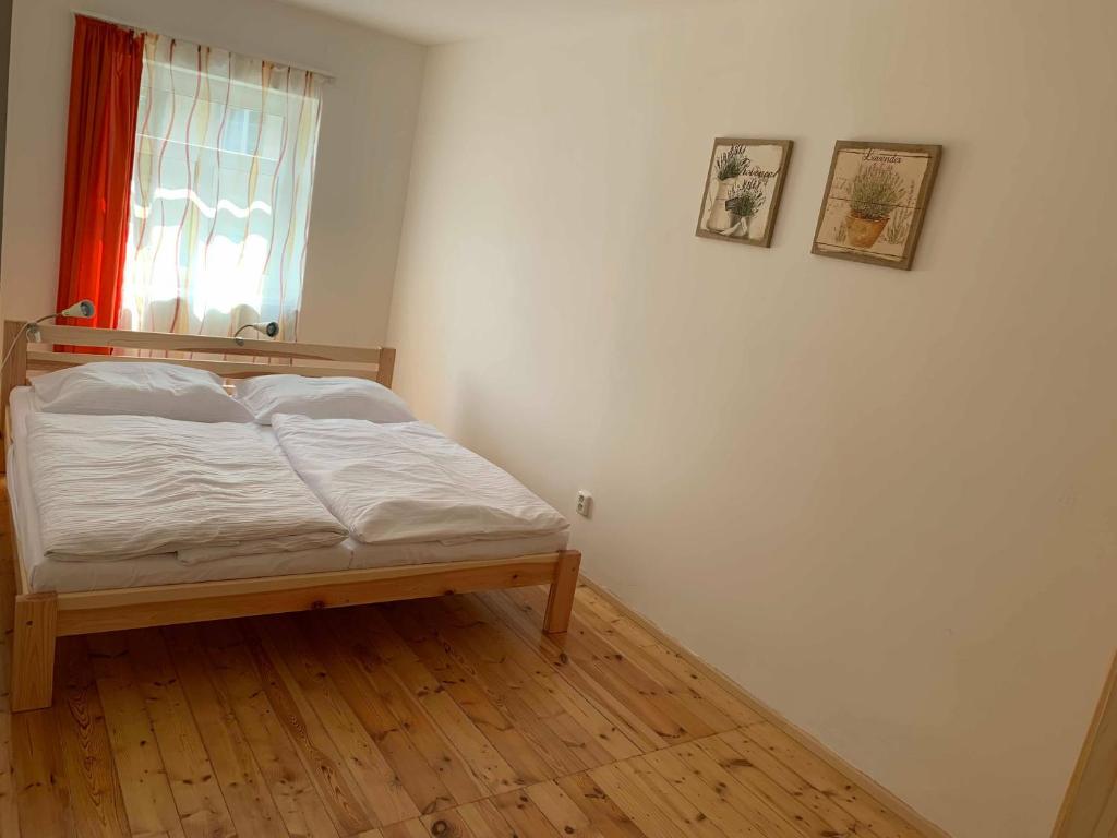 Postel nebo postele na pokoji v ubytování Apartmány Michaela
