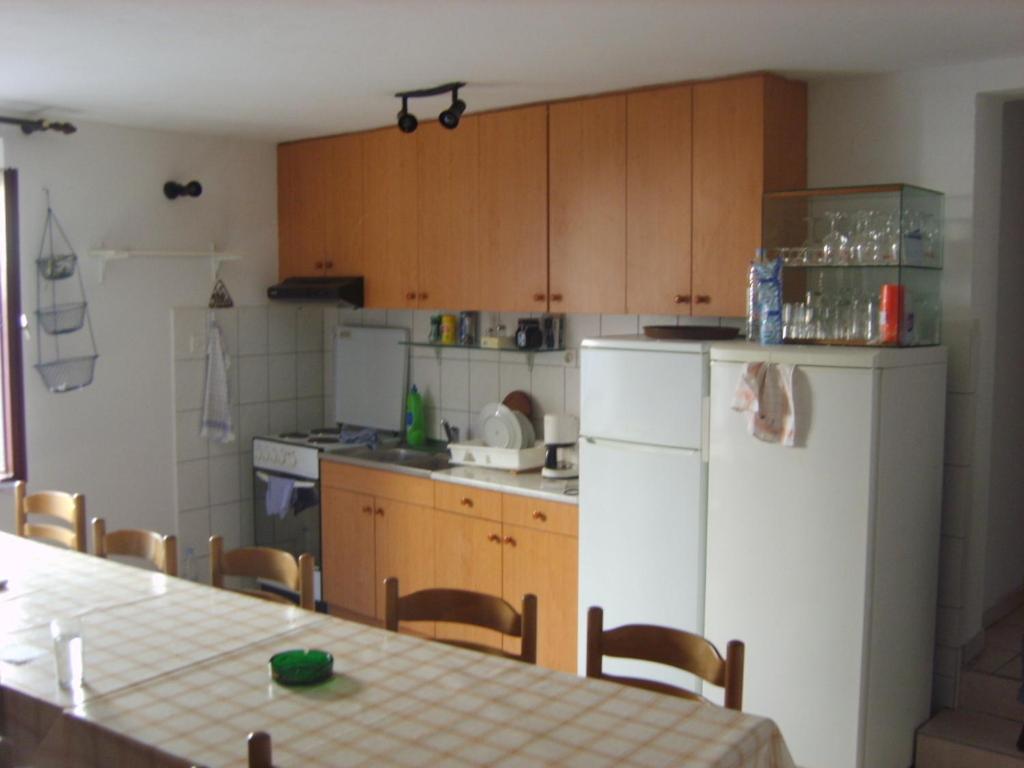 Kuchyň nebo kuchyňský kout v ubytování Rooms Roso