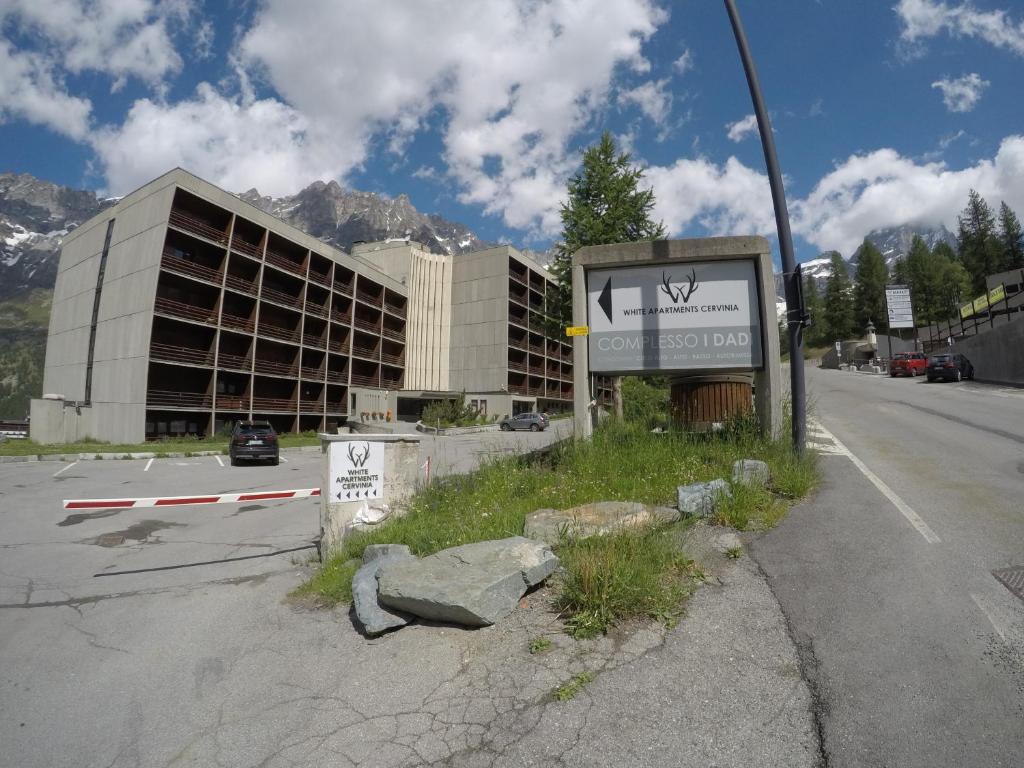 a sign on the side of a road with a building at Christian's apartments in Breuil-Cervinia