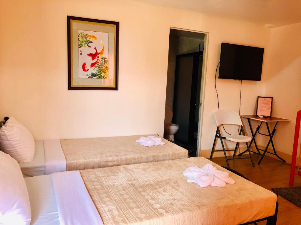 Postel nebo postele na pokoji v ubytování Havendwell Garden Resort