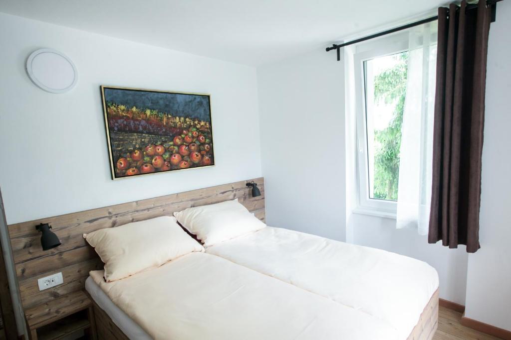 Postel nebo postele na pokoji v ubytování Hiša Poljana Rooms