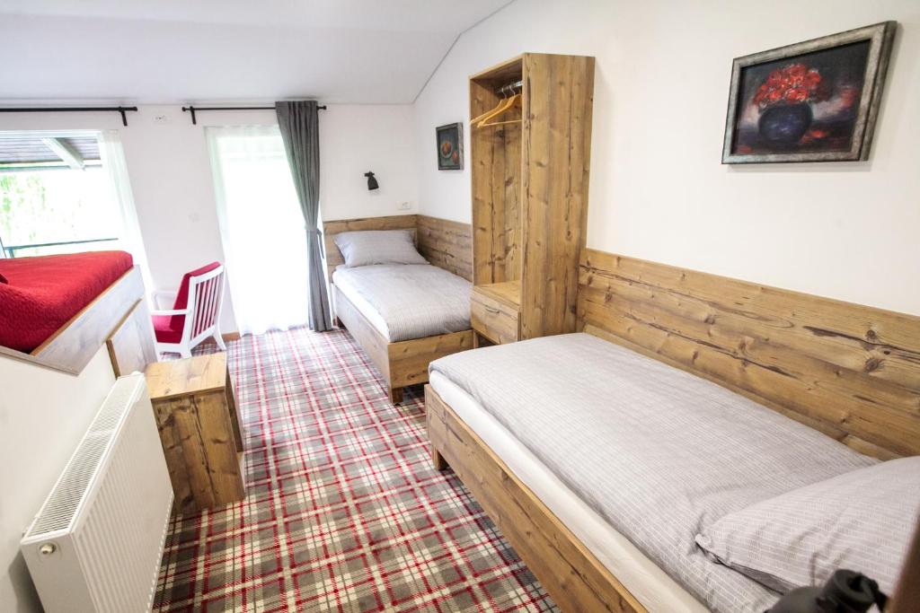 Postel nebo postele na pokoji v ubytování Hiša Poljana Rooms