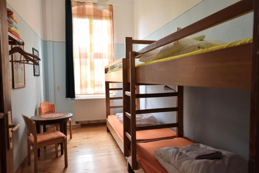 Postel nebo postele na pokoji v ubytování Herberge Orange