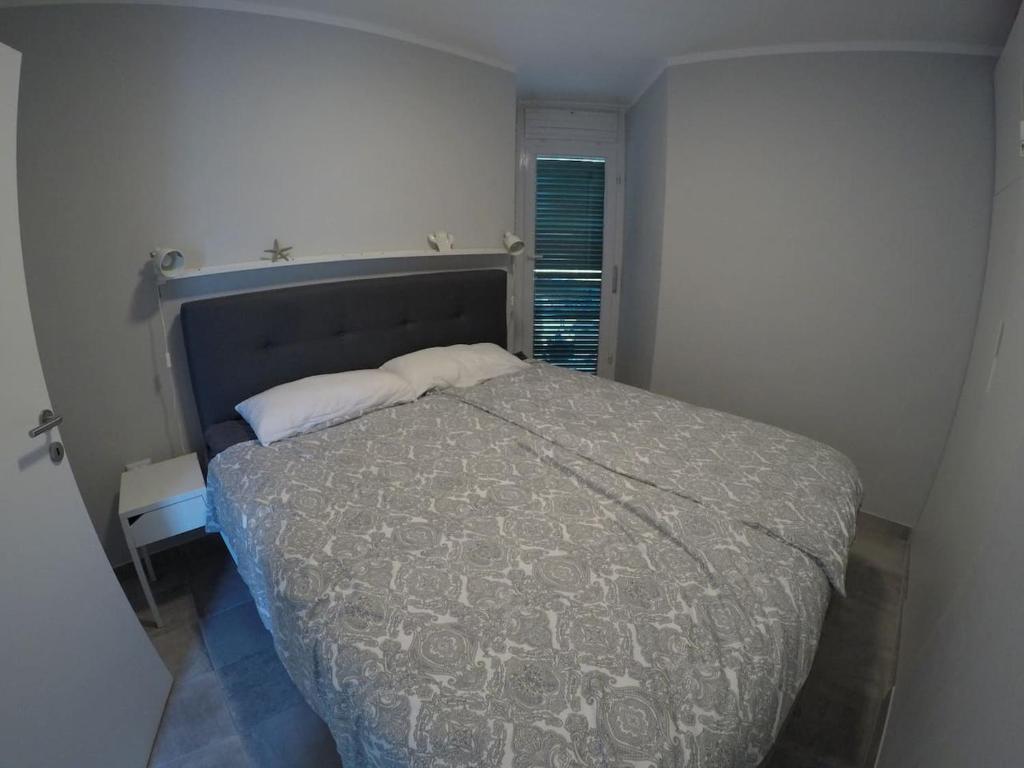 Postel nebo postele na pokoji v ubytování Apartment Galera