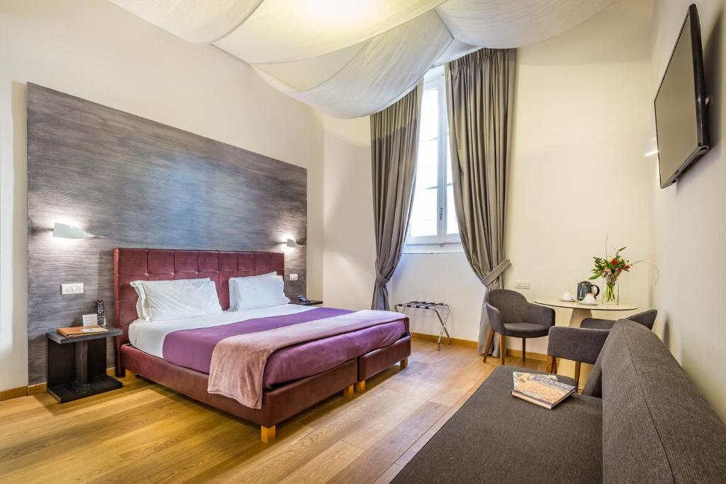 Postel nebo postele na pokoji v ubytování Hotel La Scaletta al Ponte Vecchio