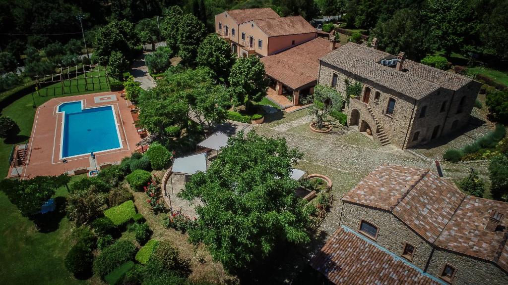 an overhead view of a house with a swimming pool at La Masseria Lolivia in Senise