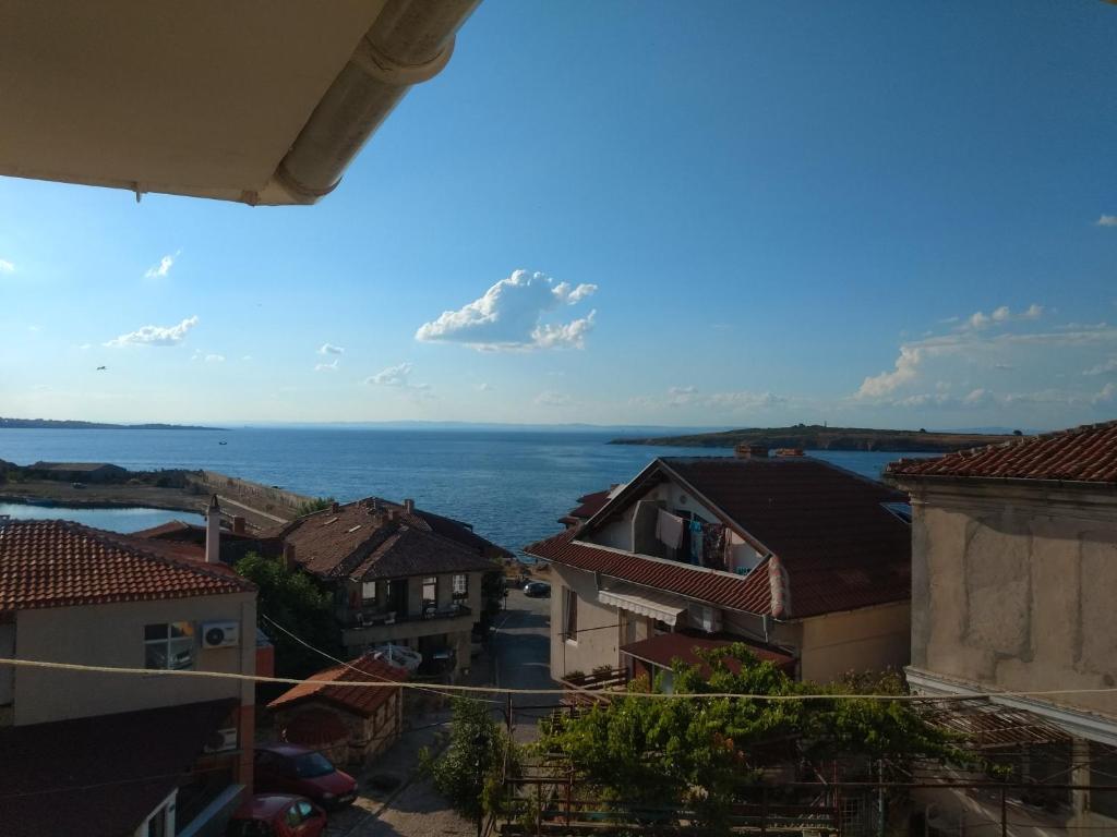 a view of the ocean from the roofs of buildings at house georgievi in Sozopol