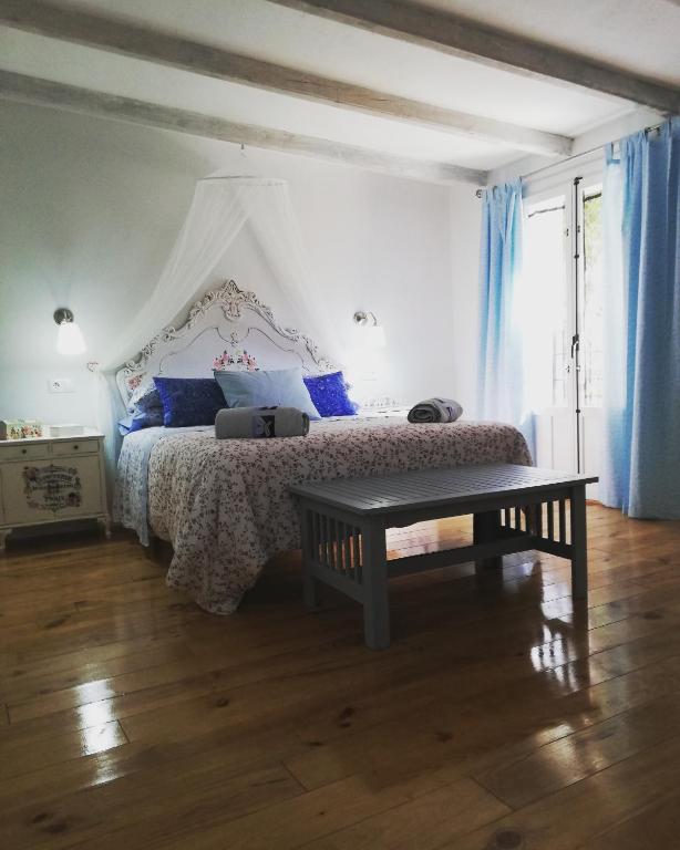 Łóżko lub łóżka w pokoju w obiekcie Alojamiento San Juan Bautista
