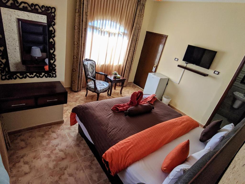 TV a/nebo společenská místnost v ubytování Anbat Midtown Hotel
