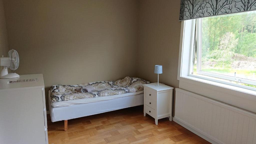 Postel nebo postele na pokoji v ubytování Nytorpsgården