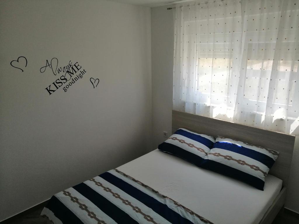 Łóżko lub łóżka w pokoju w obiekcie Apartments Venerea
