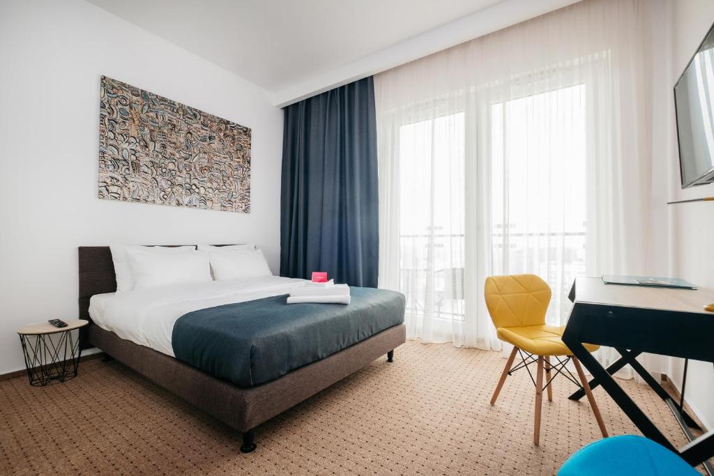 Кровать или кровати в номере Varsovia Comfort