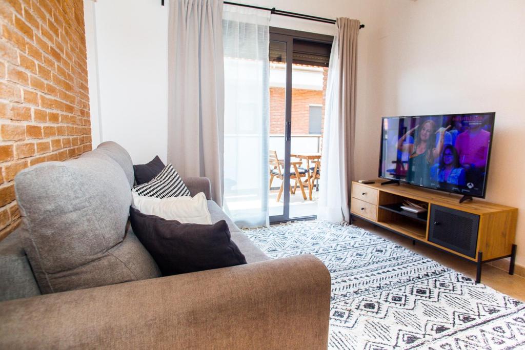 Televízia a/alebo spoločenská miestnosť v ubytovaní AL27 Duplex de diseño a 250 metros de la playa
