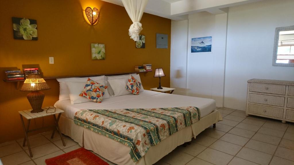 Postel nebo postele na pokoji v ubytování The Nest Tobago Apartments
