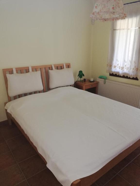 Posteľ alebo postele v izbe v ubytovaní Oneiro