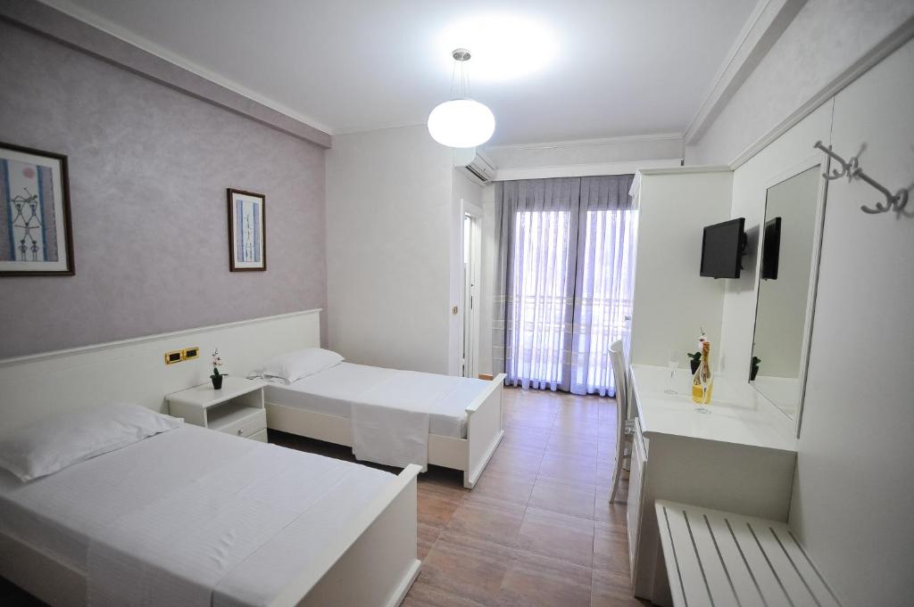 Postel nebo postele na pokoji v ubytování Iliria Internacional Hotel