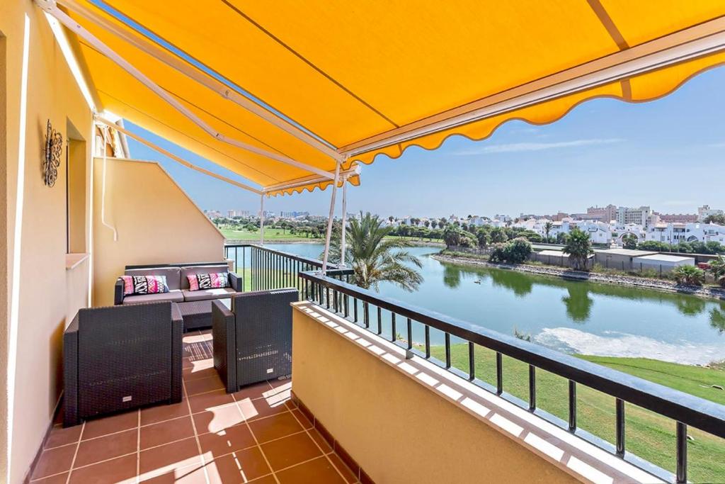 a balcony with a view of a river at Apartamento Aviacion in Roquetas de Mar