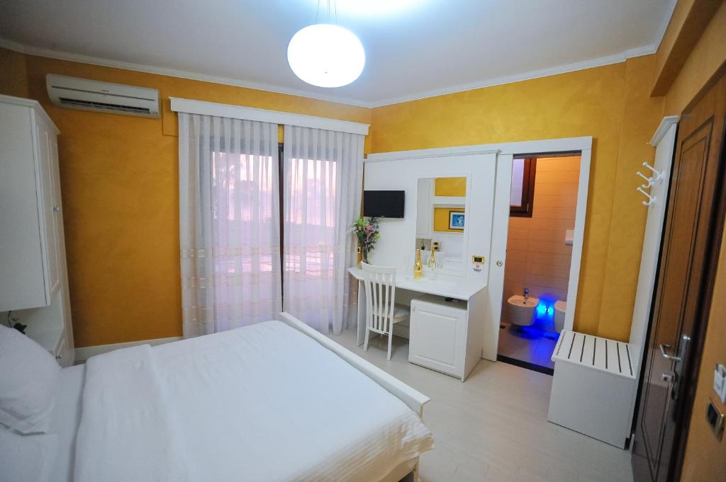 Postel nebo postele na pokoji v ubytování Iliria Internacional Hotel