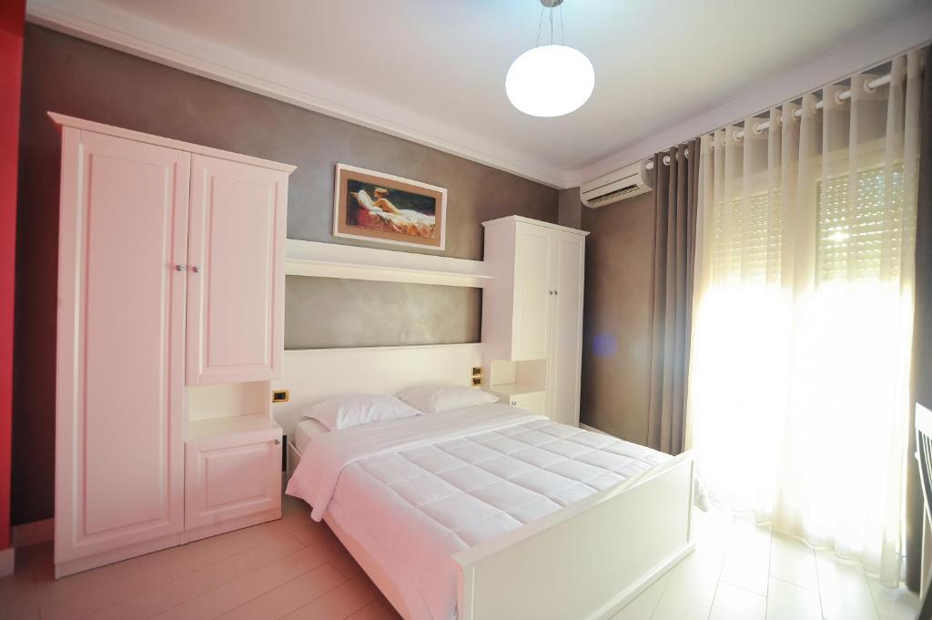 Postel nebo postele na pokoji v ubytování Iliria Internacional Hotel