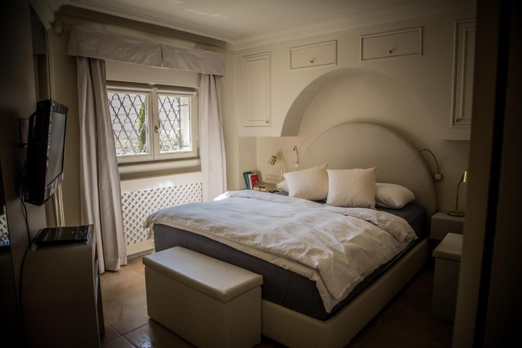 Postel nebo postele na pokoji v ubytování President Boutique Apartment