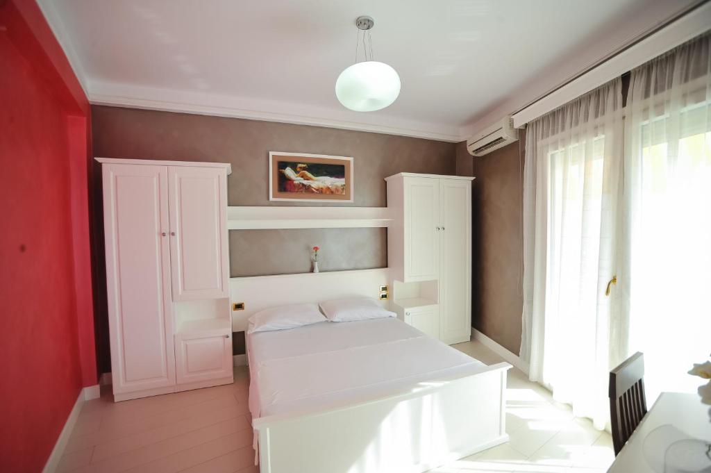 Postel nebo postele na pokoji v ubytování Iliria Internacional Hotel