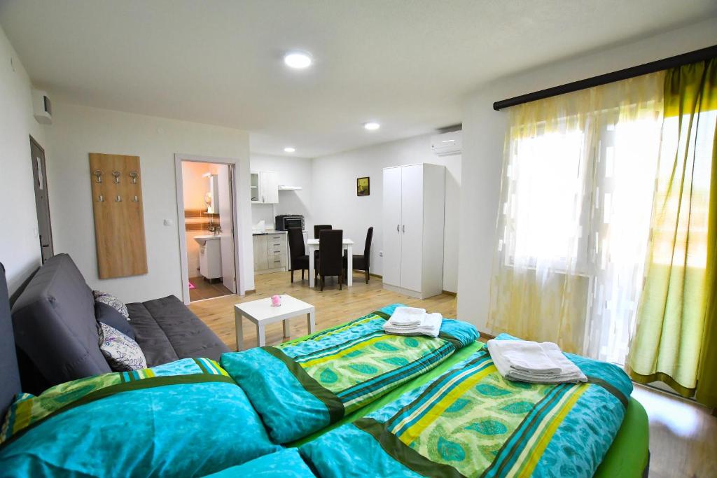 Postel nebo postele na pokoji v ubytování Vulsa Apartmani