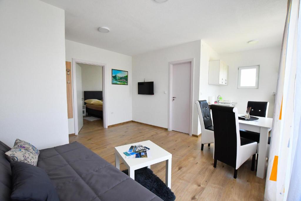 TV a/nebo společenská místnost v ubytování Vulsa Apartmani