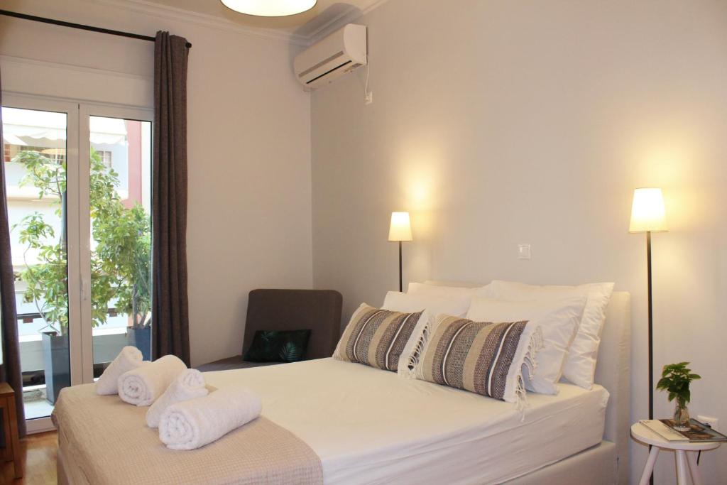 Posteľ alebo postele v izbe v ubytovaní Athenian Hub Luxe Loft