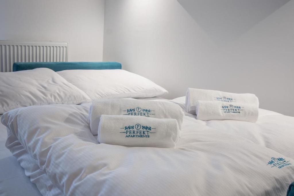 Posteľ alebo postele v izbe v ubytovaní Perfekt Apartments 5 Mórz Sianożęty