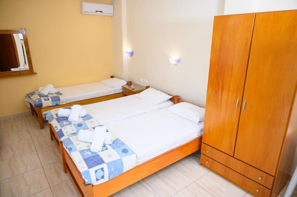 Postel nebo postele na pokoji v ubytování GLIKERIA ROOMS