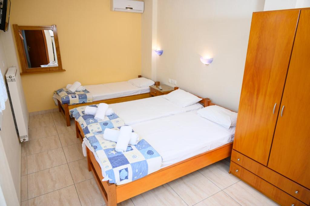 Postel nebo postele na pokoji v ubytování GLIKERIA ROOMS