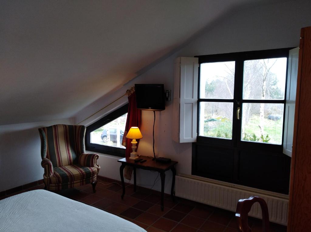 Postel nebo postele na pokoji v ubytování Hotel Rural El Pagadín