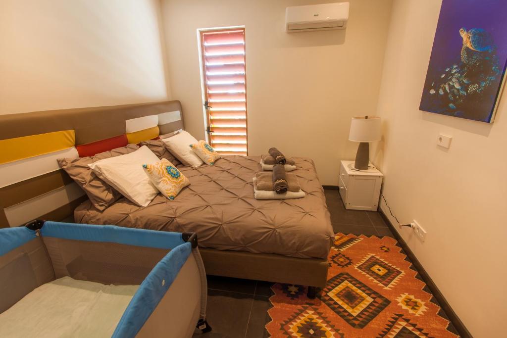 Postel nebo postele na pokoji v ubytování Villa Sol Paraiso