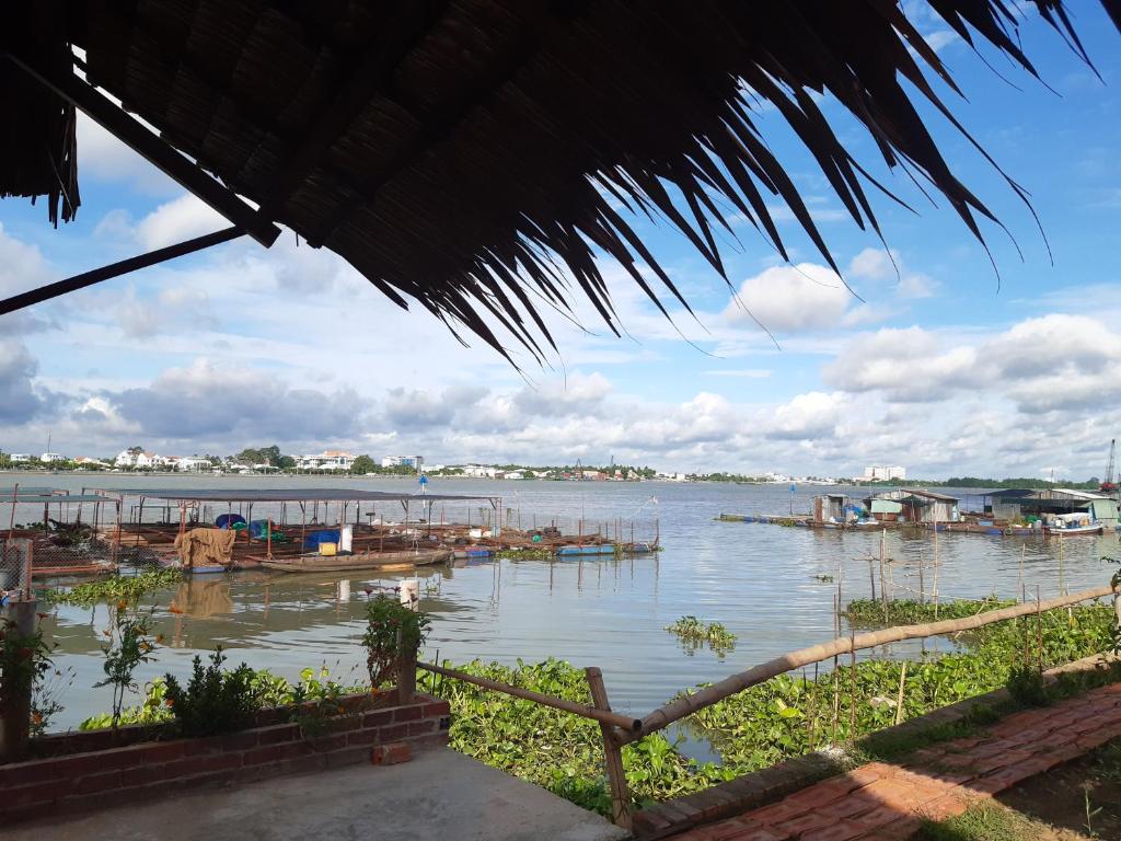 a view of a body of water with boats in it at mekong riverside homestay in Vĩnh Long